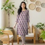 Model posing in a matching 2-piece cream lawn co-ord set with Tez Jamni (Dark Purple) floral block print motifs.