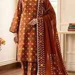 Model posing in a matching 3-piece rich chocolate brown indus dot printed lawn suit with a matching full-length dupatta.