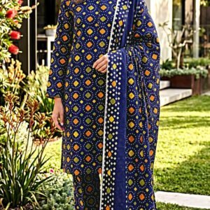 Model posing in a matching 3-piece royal indigo blue indus dot traditional bandhani lawn suit with a printed dupatta.